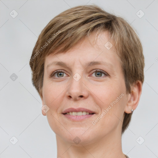 Joyful white adult female with short  brown hair and grey eyes