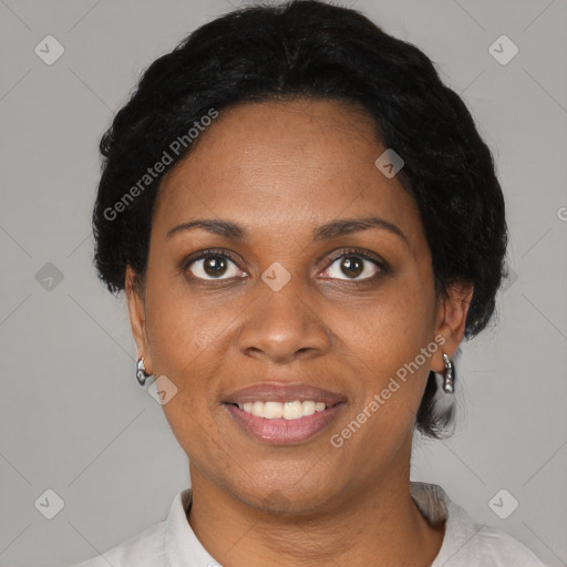 Joyful black adult female with short  brown hair and brown eyes