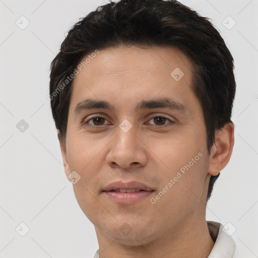 Joyful white young-adult male with short  black hair and brown eyes