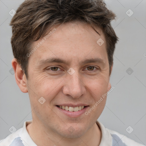 Joyful white adult male with short  brown hair and brown eyes