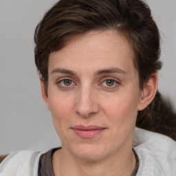 Joyful white adult female with short  brown hair and brown eyes