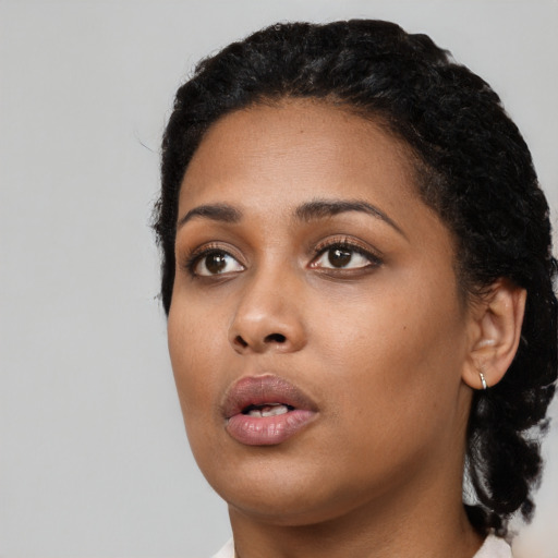 Neutral black young-adult female with long  black hair and brown eyes