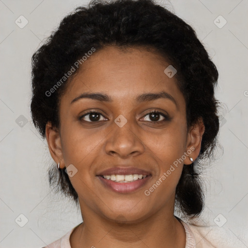 Joyful black young-adult female with short  brown hair and brown eyes