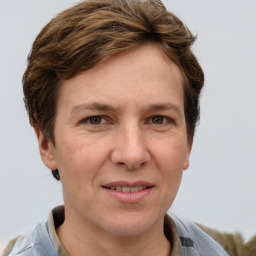 Joyful white adult female with short  brown hair and grey eyes