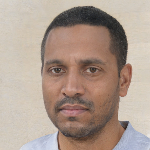 Neutral black adult male with short  black hair and brown eyes