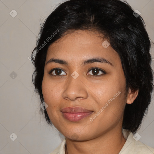 Joyful latino young-adult female with medium  black hair and brown eyes