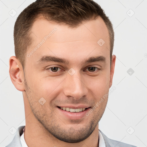 Joyful white young-adult male with short  brown hair and grey eyes