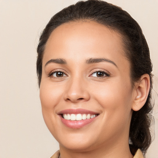 Joyful white young-adult female with medium  brown hair and brown eyes