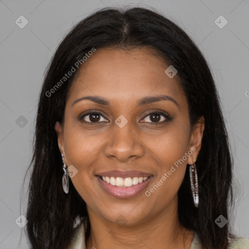 Joyful black young-adult female with long  brown hair and brown eyes