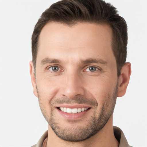 Joyful white young-adult male with short  brown hair and brown eyes