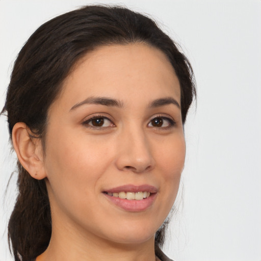 Joyful white young-adult female with long  brown hair and brown eyes