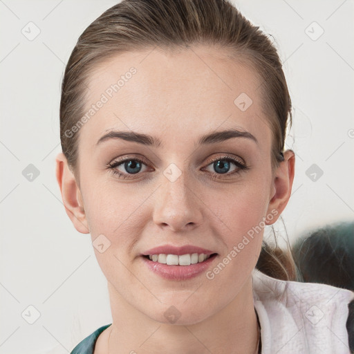 Joyful white young-adult female with medium  brown hair and grey eyes