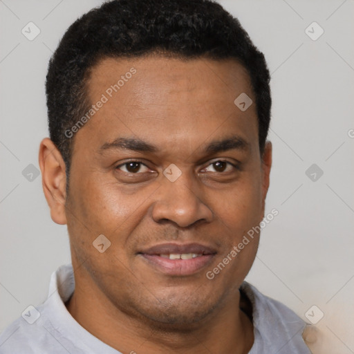 Joyful latino young-adult male with short  brown hair and brown eyes
