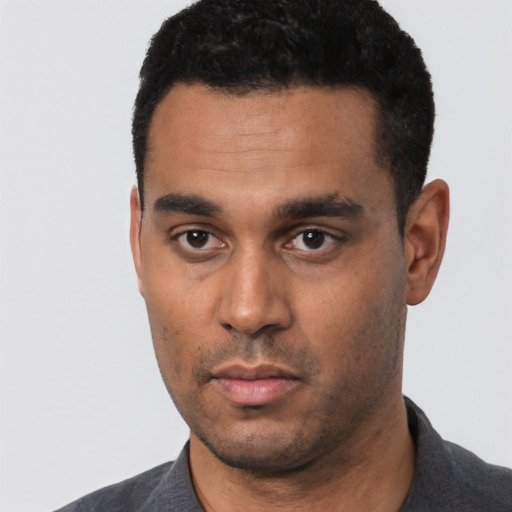 Neutral black young-adult male with short  black hair and brown eyes