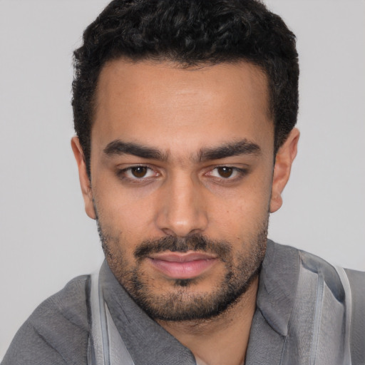 Neutral white young-adult male with short  black hair and brown eyes