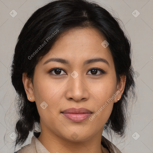 Joyful latino young-adult female with medium  brown hair and brown eyes