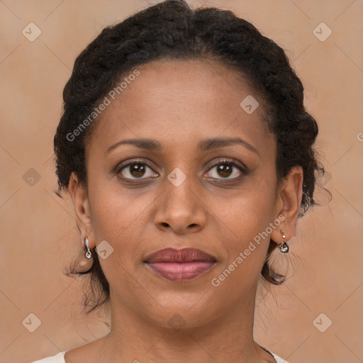 Joyful black young-adult female with medium  brown hair and brown eyes