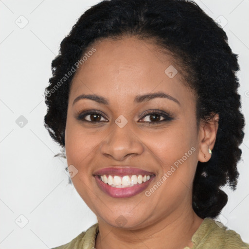 Joyful black young-adult female with long  brown hair and brown eyes