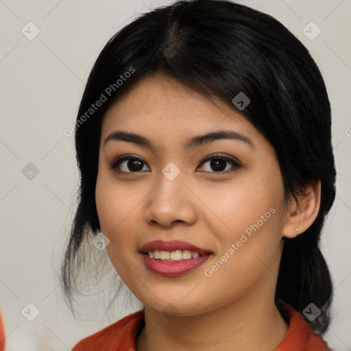 Joyful asian young-adult female with medium  black hair and brown eyes