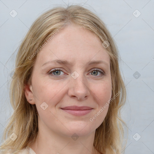 Joyful white young-adult female with medium  brown hair and blue eyes