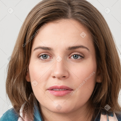 Joyful white young-adult female with medium  brown hair and blue eyes