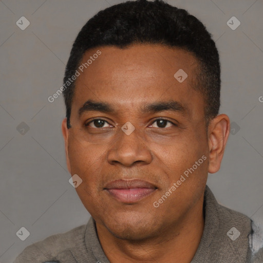 Joyful black young-adult male with short  black hair and brown eyes