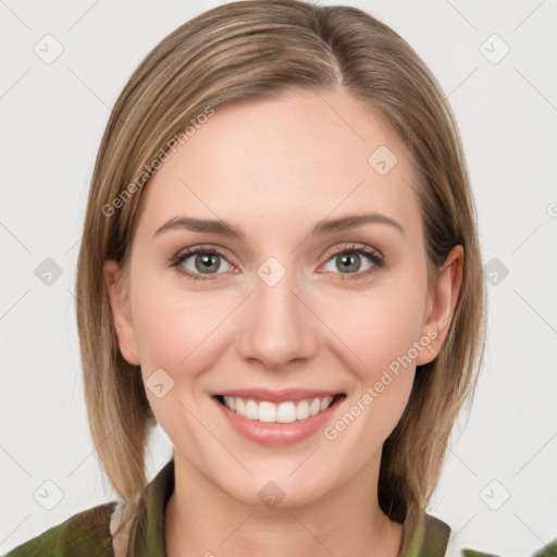 Joyful white young-adult female with medium  brown hair and green eyes