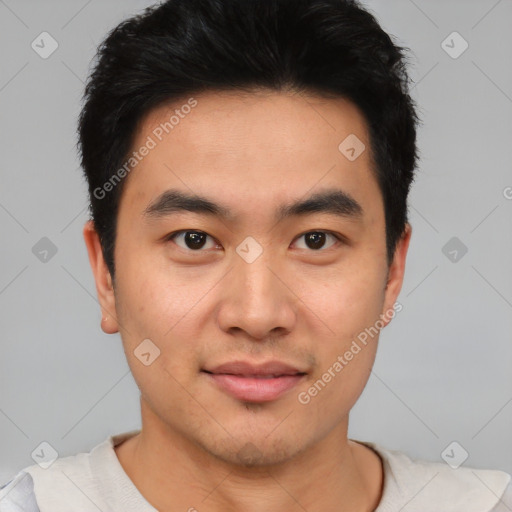 Joyful asian young-adult male with short  black hair and brown eyes