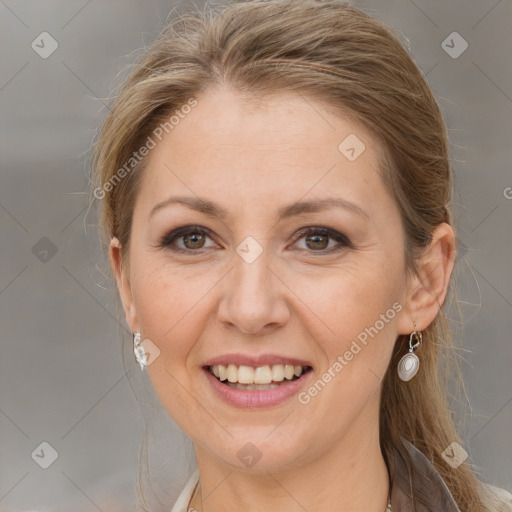 Joyful white adult female with medium  brown hair and grey eyes