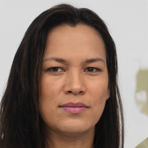Joyful asian young-adult female with long  brown hair and brown eyes