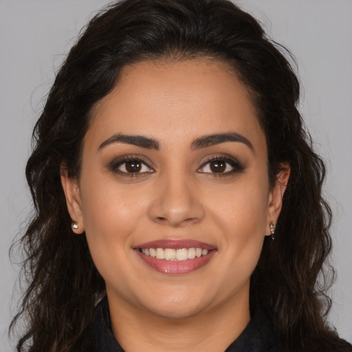 Joyful white young-adult female with long  brown hair and brown eyes