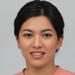 Joyful asian young-adult female with short  black hair and brown eyes