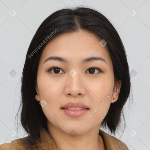 Joyful asian young-adult female with medium  black hair and brown eyes