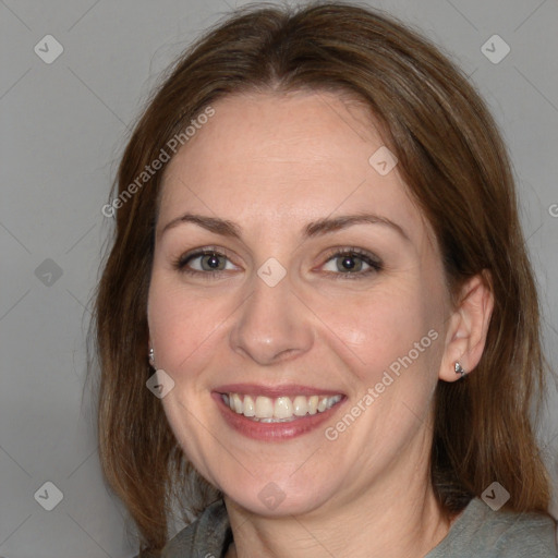 Joyful white adult female with medium  brown hair and grey eyes