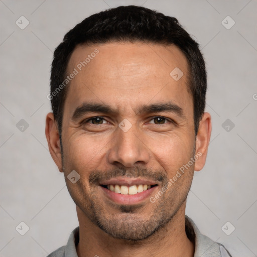 Joyful white young-adult male with short  black hair and brown eyes