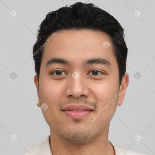 Joyful asian young-adult male with short  black hair and brown eyes