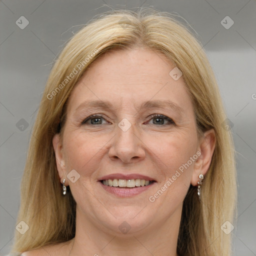 Joyful white adult female with long  brown hair and brown eyes