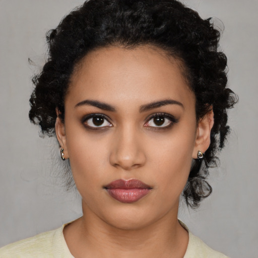 Neutral latino young-adult female with medium  black hair and brown eyes