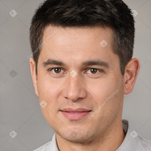 Joyful white young-adult male with short  brown hair and brown eyes