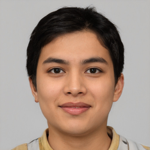 Joyful asian young-adult male with short  black hair and brown eyes