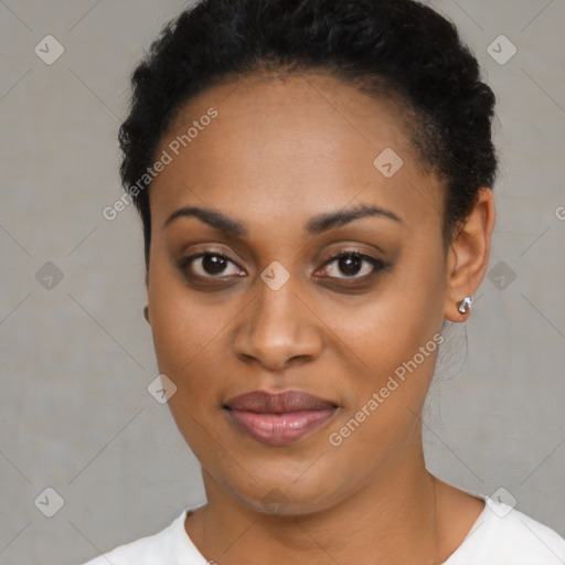 Joyful black young-adult female with short  black hair and brown eyes