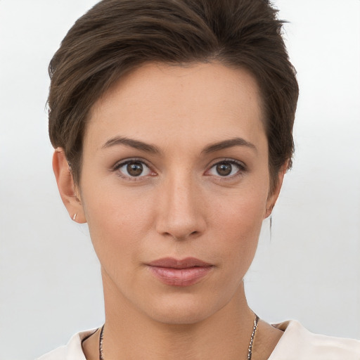 Neutral white young-adult female with short  brown hair and brown eyes