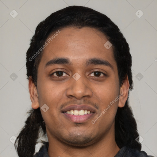 Joyful latino young-adult male with short  black hair and brown eyes