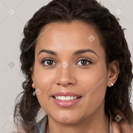 Joyful white young-adult female with long  brown hair and brown eyes