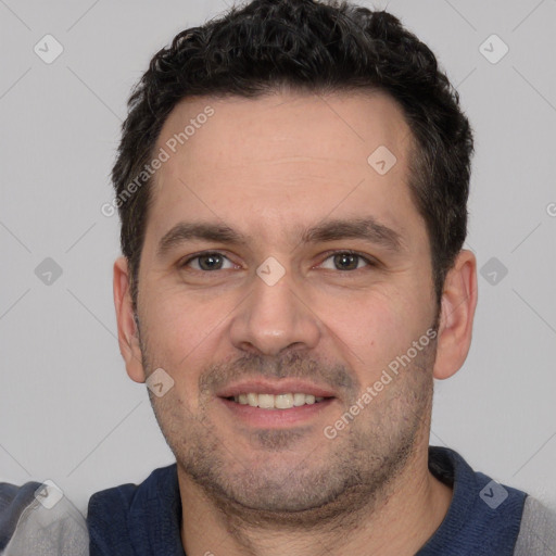 Joyful white young-adult male with short  black hair and brown eyes