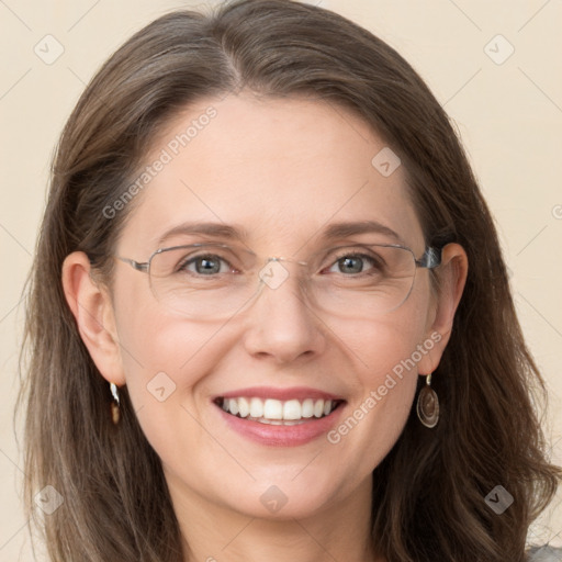 Joyful white adult female with long  brown hair and grey eyes