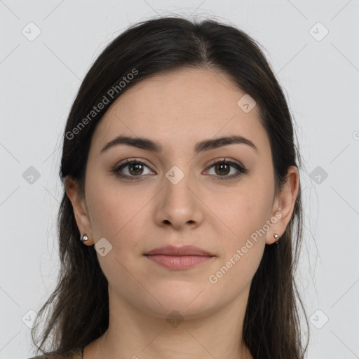 Joyful white young-adult female with long  brown hair and brown eyes