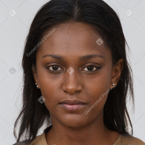 Neutral black young-adult female with long  brown hair and brown eyes