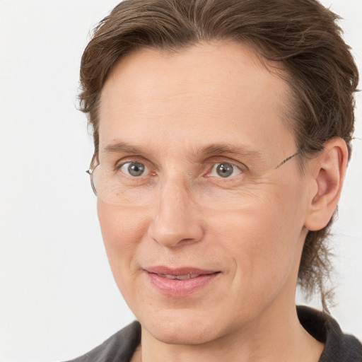 Joyful white adult male with medium  brown hair and grey eyes