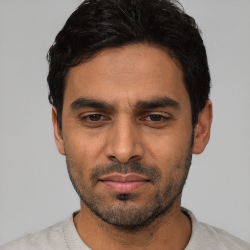 Neutral latino young-adult male with short  black hair and brown eyes